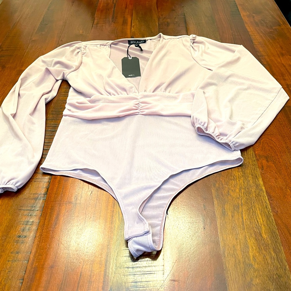 Mesh bodysuit.  Runs small!!!